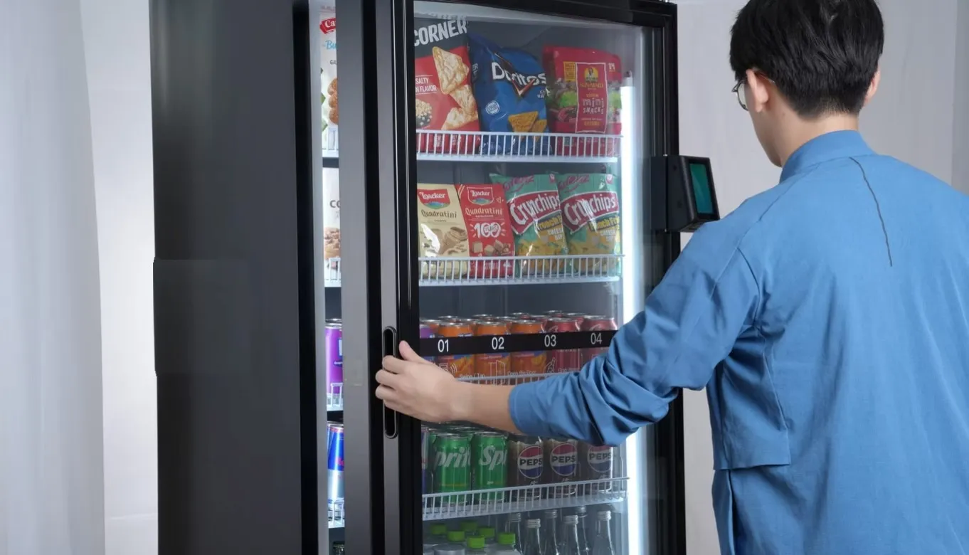 A customer making a cashless purchase at a smart vending machine